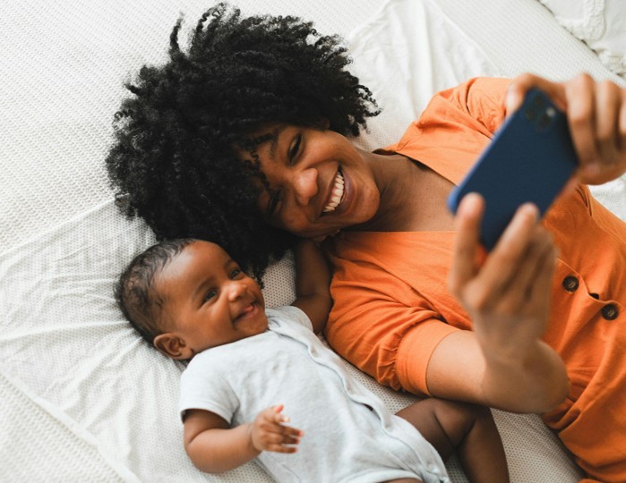 Mother and baby with phone